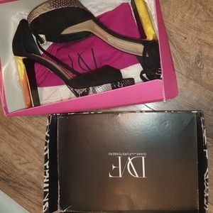 DvF women size 9 black gold and python color